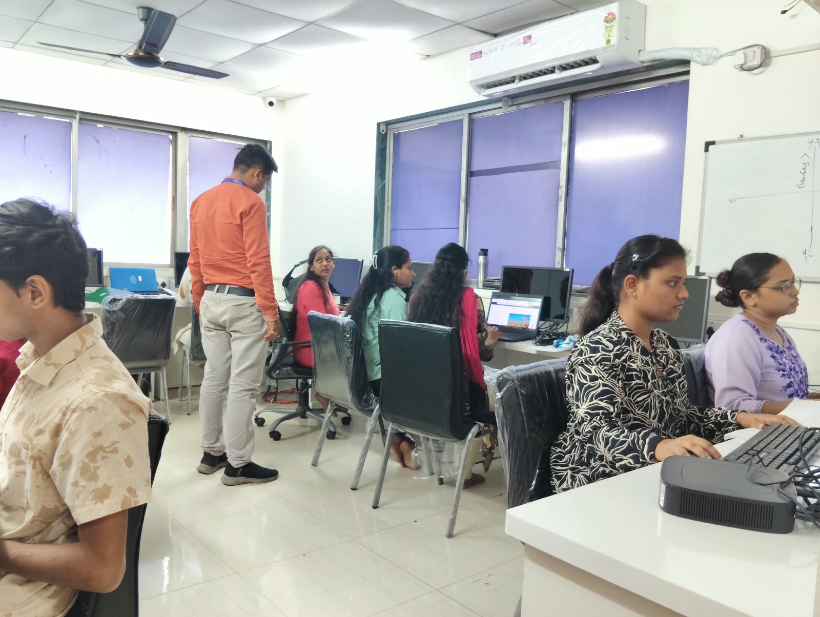 Students working at desktop computers in the IT Accurate Kalyan classroom