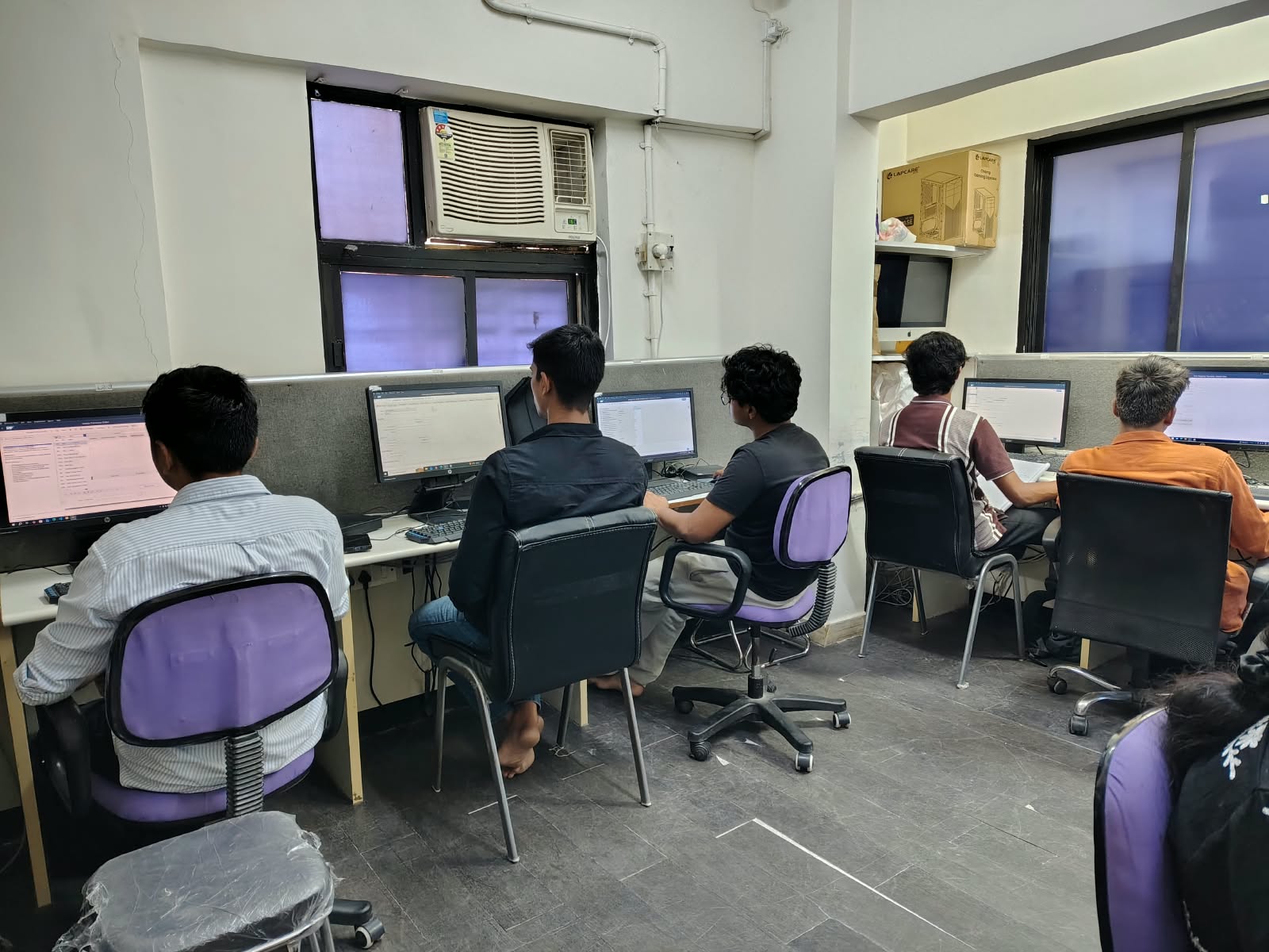 Participants working at desktop computers in the IT Accurate Thane lab.